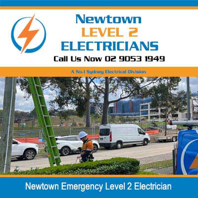 Emergency electrical service vehicles parked on residential street for urgent repairs in Newtown