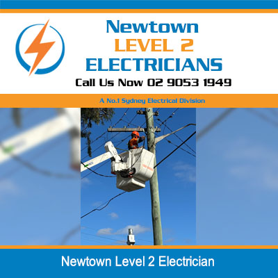 Level 2 electrician in elevated work platform servicing overhead power lines in Newtown