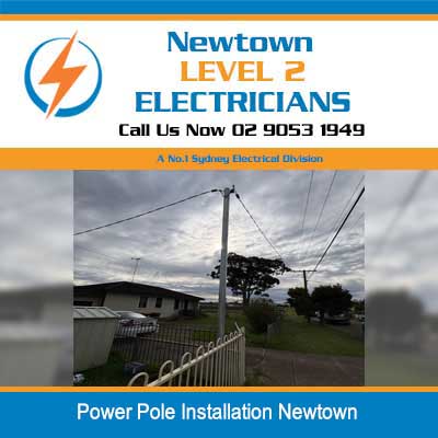 Power pole replacement with overhead electrical lines in residential street of Newtown