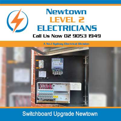 Electrical switchboard upgrade showing circuit breakers and safety warning label in Newtown